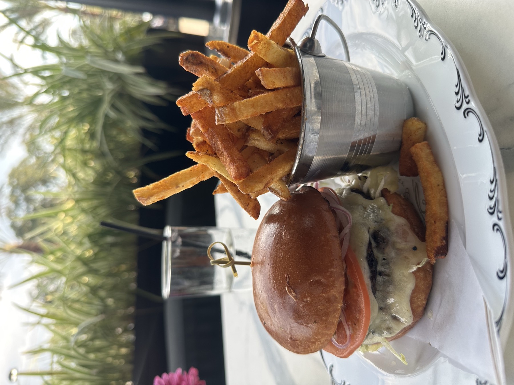 Gourmet burger and fries styled for a restaurant feature