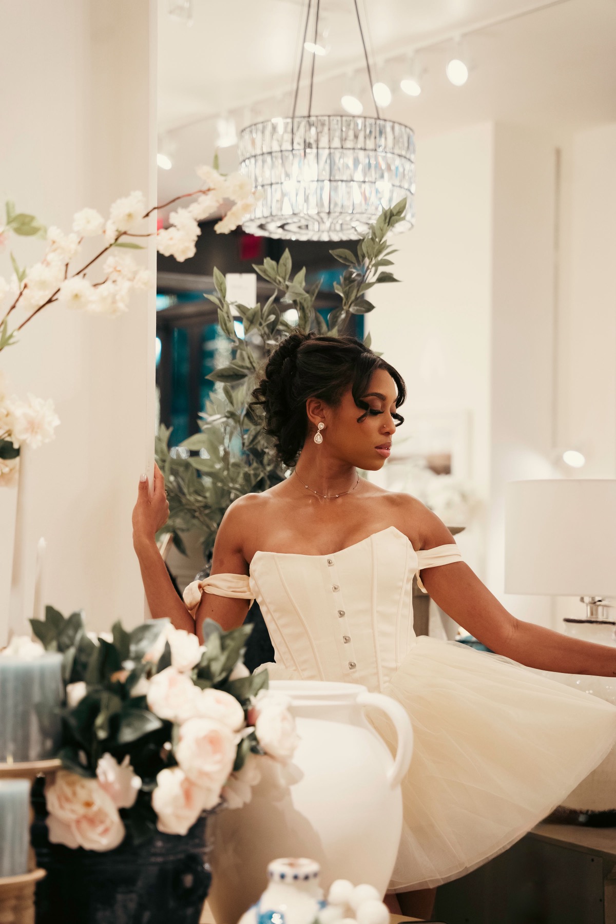 Iyana Admasu in a ballerina dress with flowers in the foreground